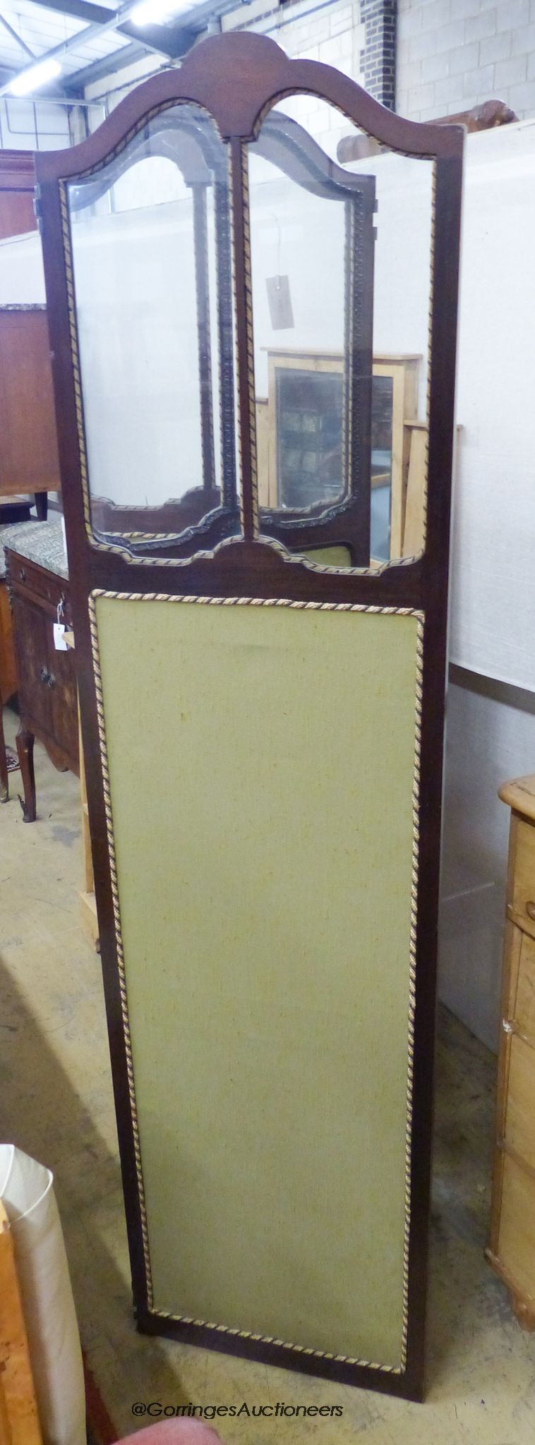 A carved mahogany and glazed three-fold dressing screen, each panel width 46cm, height 178cm